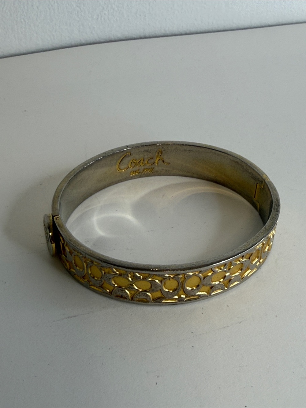 Coach Two-Tone Signature C Enameled Turnlock Hinged Bangle Bracelet